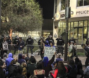 This Dec. 6, 2014 file photo shows demonstrators protesting in front of the Berkeley police station in Berkeley, Calif.