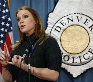 Denver police Cmdr. Magen Dodge takes questions from members of the media during a news conference about the police use of body cameras Tuesday, March 10, 2015.