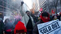 Police arrest 17 protesters who blocked trains near Super Bowl