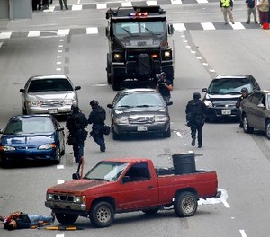 In this June 6, 2013 file photo, Los Angeles police take part in a downtown counterterrorism drill.