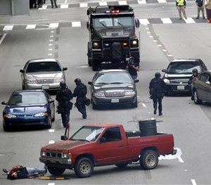 In this June 6, 2013 file photo, Los Angeles police take part in a downtown counterterrorism drill.