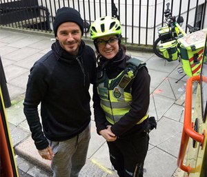 David Beckham poses with bike paramedic Catherine Maynard.