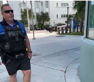 In a video posted on Instagram, Miami Beach police officer William Beeker is seen escorting three handcuffed semi-nude women in a fake arrest. (Photo/Instagram)