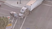 Video: Big rig driver crashes into murder suspect's truck to end police pursuit