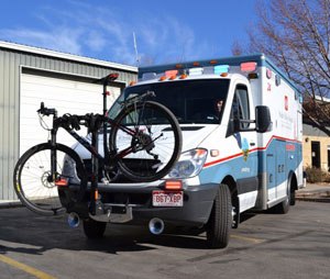 This photo made available Friday by University of Colorado Health, shows a Poudre Valley Hospital ambulance fitted with a bike rack, in Fort Collins, Colo. In a testament to how much the city loves its bikes, the hospital has installed bike racks on its ambulances after encountering increasing numbers of cyclists who had bicycle accidents or medical emergencies. (AP Photo/University of Colorado Health, Kelly Tracer)
