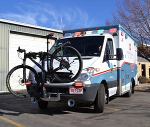 This photo made available Friday by University of Colorado Health, shows a Poudre Valley Hospital ambulance fitted with a bike rack, in Fort Collins, Colo. In a testament to how much the city loves its bikes, the hospital has installed bike racks on its ambulances after encountering increasing numbers of cyclists who had bicycle accidents or medical emergencies. (AP Photo/University of Colorado Health, Kelly Tracer)
