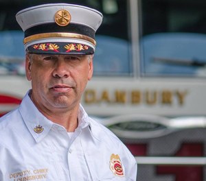 Danbury Fire Department Deputy Fire Chief Bill Lounsbury teamed up with a pediatrician to help a fellow airplane passenger who was having an anaphylactic reaction. (Photo/Danbury Fire Department Facebook)