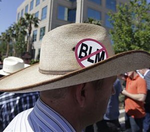 Ammon Bundy, son of rancher Cliven Bundy stands outside Metropolitan Police Department headquarters, Friday, May 2, 2014 in Las Vegas.