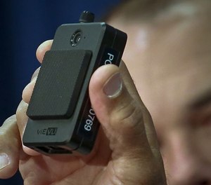 In this Jan. 30, 2018 file photo, a newly issued police body camera is shown during a NYPD news conference in New York. A New York appeals court has ruled that police body camera footage is subject to public disclosure under state law. (AP Photo/Bebeto Matthews, File)