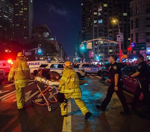 In this Sept. 17, 2016 file photo, first responders work near the scene of an explosion in Manhattan's Chelsea neighborhood, in New York. (AP Photo/Andres Kudacki, File)