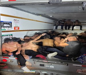 This photo shows several dozen migrants crammed inside a U-Haul box after they were found by Border Patrol agents.