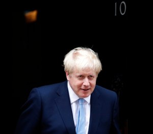 Britain's Prime Minister Boris Johnson leaves the door to welcome King Abdullah II of Jordan at 10 Downing Street in London, Wednesday, Aug. 7, 2019. Johnson holds bilateral talks and a working lunch with the King of Jordan. (AP Photo/Frank Augstein)