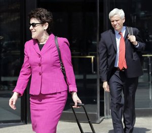Defense attorneys Miriam Conrad, left, and David Bruck leave federal court in Boston, Monday, May 4, 2015. (AP Image)