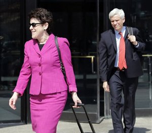 Defense attorneys Miriam Conrad, left, and David Bruck leave federal court in Boston, Monday, May 4, 2015.