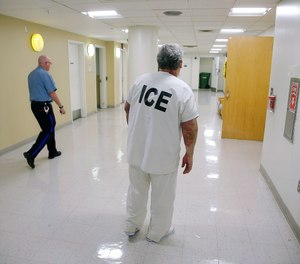 In this Sept. 1, 2017 file photo, Massachusetts Institute of Technology janitor Francisco Rodriguez-Guardado, facing deportation to El Salvador, returns to his cell during detainment by the department of Immigration and U.S. Customs Enforcement in the Suffolk County House of Correction in Boston.