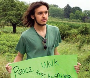 In this July 26, 2012 photo provided by the Northumberland News, Alexander Ciccolo participates in a peace walk through Brighton, Ontario.