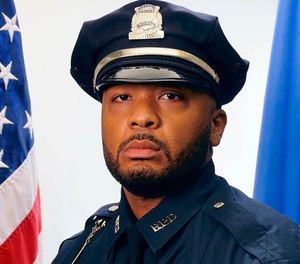 This undated official portrait released by the Boston Police Department shows policer officer Dennis Simmonds, who died on April 10, 2014.