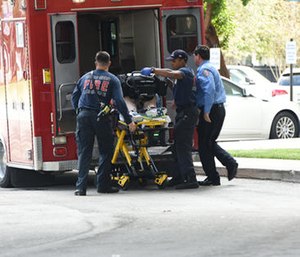 A shooting victim is unloaded from an emergency vehicle and taken into Broward Health Trauma Center.