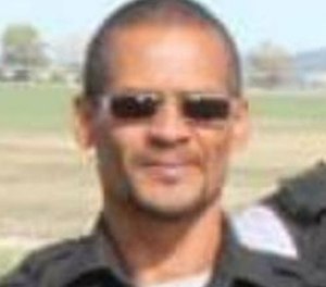 Officer Brian Gerard Garrett was not on duty at the time of the shooting.