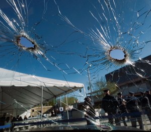 An inside view of a bullet ridden Los Angeles police department patrol car windshield is seen on display prior to a ceremony marking the 20th anniversary of an infamous gunbattle between police and two heavily armed bank robbers in Los Angeles on Tuesday, Feb. 28, 2017.