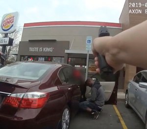 In this frame grab from a Charlotte-Mecklenburg Police Department officer body camera released Monday, April 15, 2019, shows two officers approaching 27-year-old Danquirs Napoleon Franklin outside a Burger King on March 29, 2019 in Charlotte, NC. Franklin was shot and killed. (Charlotte-Mecklenburg Police Department via AP)