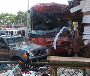 FDNY says the bus driver swerved to avoid hitting a car when he crashed into the building.