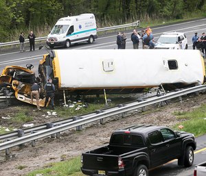 A school bus taking children on a field trip to a historic site collided with a dump truck on Thursday, ripping the bus apart and killing a student and a teacher. (Photo/AP)