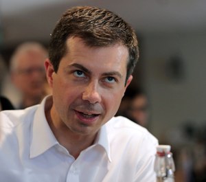 In this July 12, 2019 file photo, Democratic presidential candidate South Bend Mayor Pete Buttigieg campaigns at the Revolution Taproom & Grill, in Rochester, N.H. (AP Photo/Charles Krupa File)