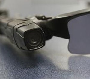 In this Jan. 15, 2014, file photo, a wired on-body police video camera is clipped to a Los Angeles Police officers glasses during a media demonstration in Los Angeles.