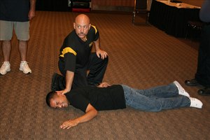 Street Smart EMS founder and retired Fire Chief Howard Munding shows off some Krav Maga self-defense tactics.
