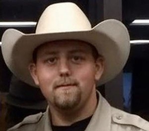 Deputy Chris Dickerson had been with the sheriff's department for eight years. He was married with two young children.
