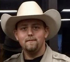 Deputy Chris Dickerson had been with the sheriff's department for eight years. He was married with two young children.