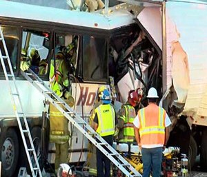 This photo shows the scene of crash between a tour bus and a semi-truck on Oct. 23, 2016. (KESQ NewsChannel 3/CBS Local 2 via AP)