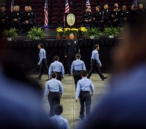 Los Angeles Police Department Chief Charlie Beck inspects the cadets before their graduation at the USC Galen Center in Los Angeles on Saturday, June 24, 2017.