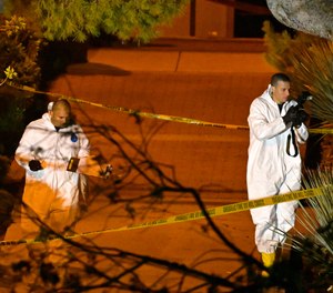 A forensics team works the scene Thursday, Nov. 8, 2018, in Thousand Oaks, Calif. where a gunman opened fire Wednesday inside a country dance bar crowded with hundreds of people on