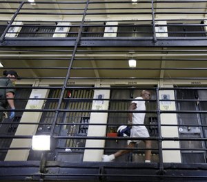 In this Aug. 16, 2016 file photo, a condemned inmate walks along the east block of death row at San Quentin State Prison. (Photo/AP)