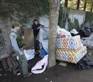 Sonoma County Park Ranger Darren Davis encourages homeless campers to finish packing their belongings as authorities cleared the Joe Rodota Trail homeless encampment in Santa Rosa.
