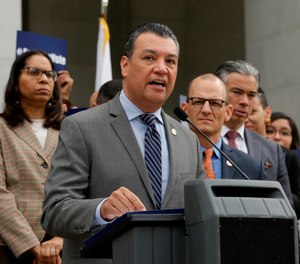 Secretary of State Alex Padilla discusses a proposed constitutional amendment to allow parolees to vote as the amendment's author, Assemblyman Kevin McCarty, D-Sacramento, right, looks on during a news conference at the Capitol, Monday Jan. 28, 2019, in Sacramento, Calif.