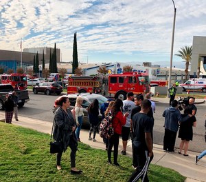 Student gather outside Saugus High School in Santa Clarita after a shooting that killed 2 students and wounded others.