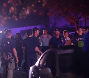 Multiple people were shot and at least four of them were killed Sunday at a party in Fresno when suspects broke into the backyard and fired into the crowd, police said. (Photo/Larry Valenzuela/The Fresno Bee/AP)