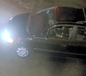 Police are investigating this 1998 dark-colored Honda Odyssey officers found in the area during the incident.