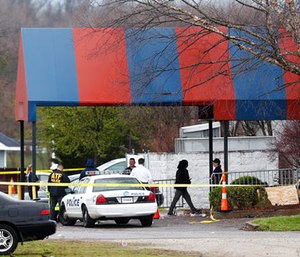 Members of the ATF and local police work at a crime scene at the Cameo club after a fatal shooting, Sunday, March 26, 2017, in Cincinnati. (AP Photo/John Minchillo)