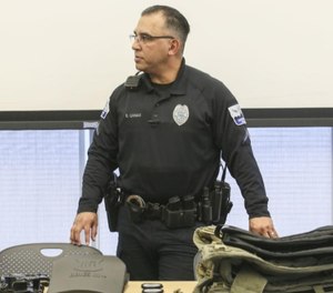 Davenport Police Officer Peme Canas shows some of the gear collected for the six-person Savoonga Police Department in Alaska.