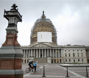 In this Nov. 12, 2014 file photo, cyclists ride on Capitol Hill in Washington.