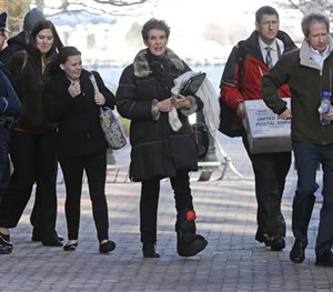 People leave federal court to board a bus after attending the federal death penalty trial of Dzhokhar Tsarnaev in Boston, Thursday, March 12, 2015. (AP Image)