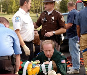 John Hultgren caring for a 3-year-old MVC victim.