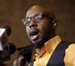 National Action Network Ferguson chapter president Rev. Carlton Lee speaks during a news conference Friday, Nov. 21, 2014, in St. Louis County, Mo.