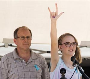 Cassidy Stay, the lone survivor of a family massacre in Texas, speaks during a community memorial at Lemm Elementary School on Saturday, July 12, 2014, in Spring, Texas.