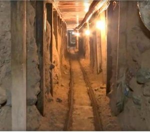 In this frame grab taken from a Monday, Dec. 12, 2016 video provided by the Mexican Attorney General's Office, or PGR, shows one of two tunnels found in an area of warehouses in the border city of Tijuana that lead into California.