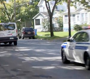 In this image taken from video provided by WHAM-TV 13, in Rochester, N.Y., police pursue a van, Wednesday, Oct. 10, 2018, in Rochester. Police killed the driver in a shootout during the chase.